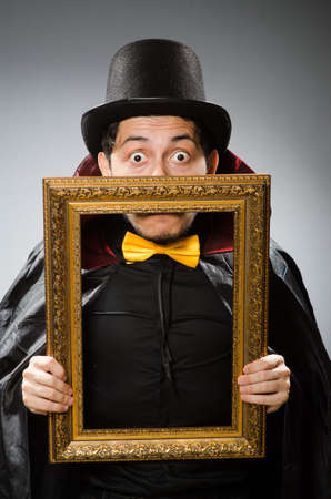 Funny man with picture frameの写真素材