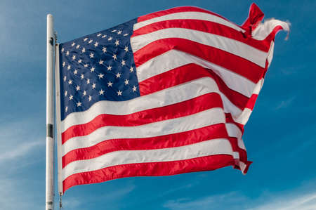 American flag against bright blue sky