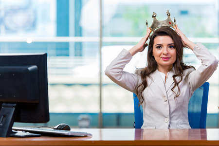 Businesswoman sitting at the office deskの写真素材
