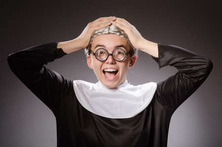 Funny man wearing nun clothingの写真素材