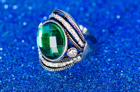 Jewellery ring against blue background