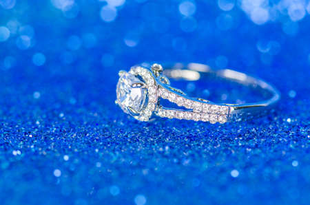 Jewellery ring against blue backgroundの写真素材