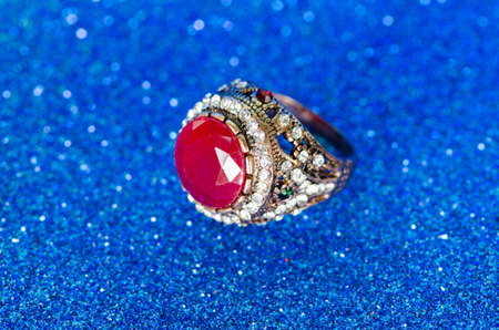 Jewellery ring against blue backgroundの写真素材