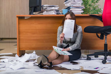 Businesswoman under stress working in the office