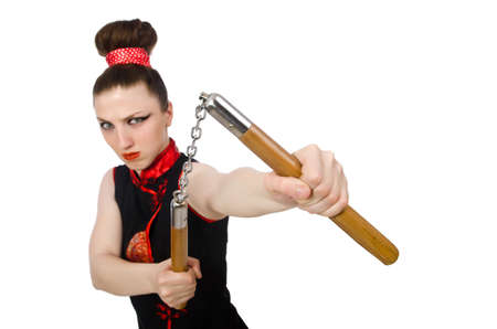 Funny woman with nunchucks isolated on whiteの写真素材