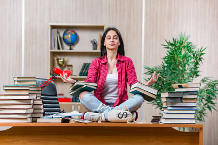 Young female student preparing for college school examsの写真素材