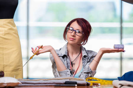 Woman tailor working at her desk