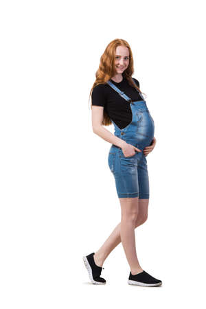 Young pregnant woman isolated on whiteの写真素材