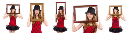Pretty girl in red polka dot   dress with picture frame  isolated on white
