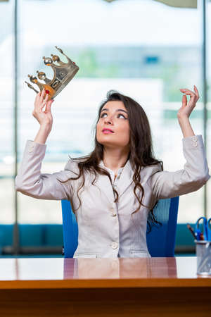 Businesswoman sitting at the office deskの写真素材