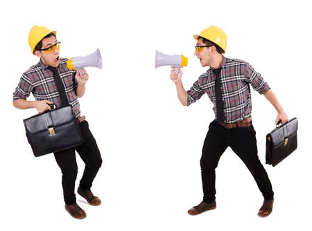 Young construction worker with loudspeaker isolated on whiteの写真素材