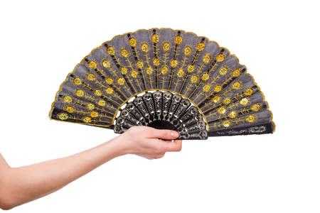Hand holding fan isolated on white backgroundの写真素材