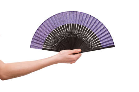 Hand holding fan isolated on white backgroundの写真素材