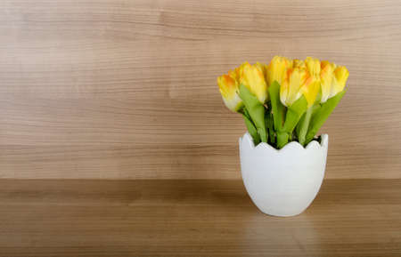 Tulip flowers against wooden backgroundの写真素材
