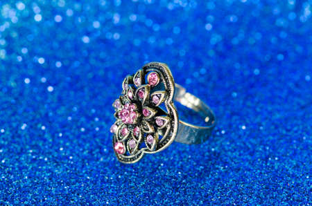 Jewellery ring against blue backgroundの写真素材