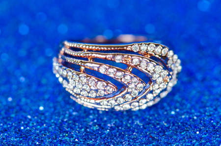 Jewellery ring against blue backgroundの写真素材