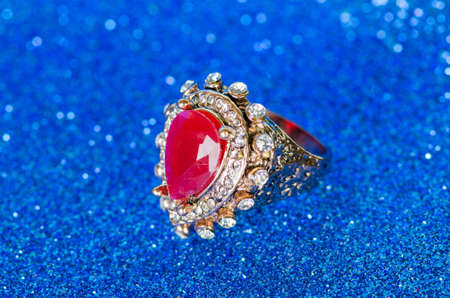 Jewellery ring against blue backgroundの写真素材