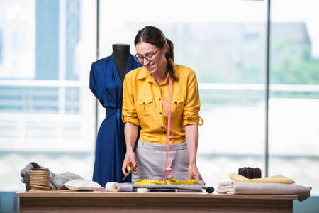 Woman tailor working on new clothing