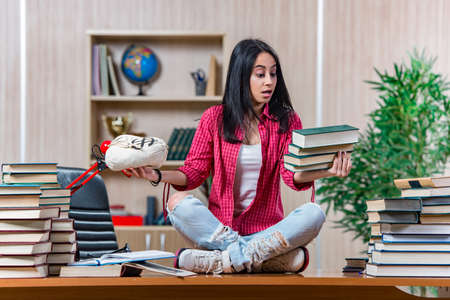 Young female student preparing for college school examsの写真素材