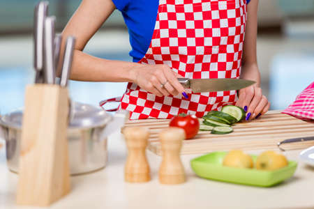 Young woman working in the kitchen