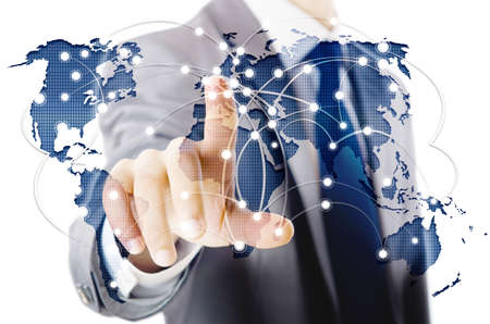 Man pressing dots on world map in global communication concept