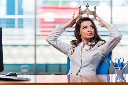 Businesswoman sitting at the office deskの写真素材