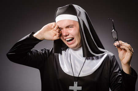 Funny man wearing nun clothingの写真素材