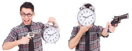 Young man with clock isolated on white