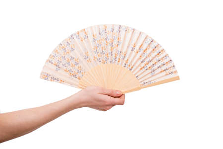 Hand holding fan isolated on white backgroundの写真素材
