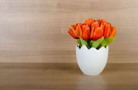 Tulip flowers against wooden background