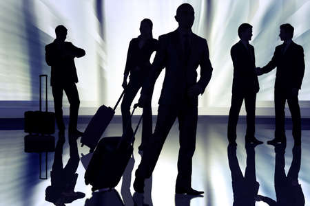 People at the airport with luggageの写真素材