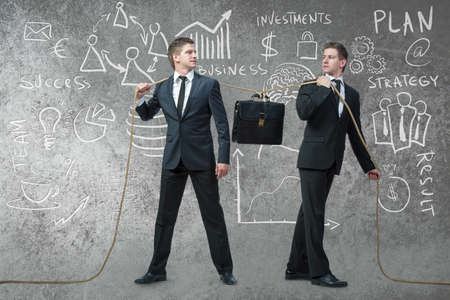 Twin brothers with various business conceptsの写真素材