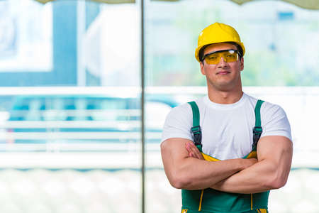 Young construction worker working at the site