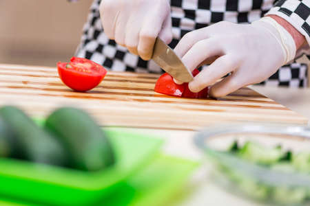 Male cook preparing food in the kitchen