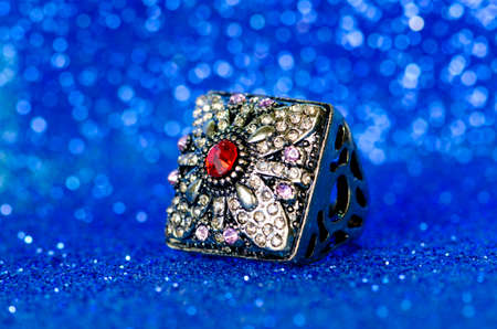 Jewellery ring against blue backgroundの写真素材
