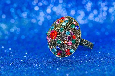 Jewellery ring against blue backgroundの写真素材