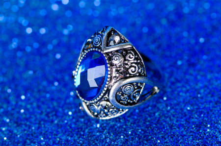 Jewellery ring against blue backgroundの写真素材