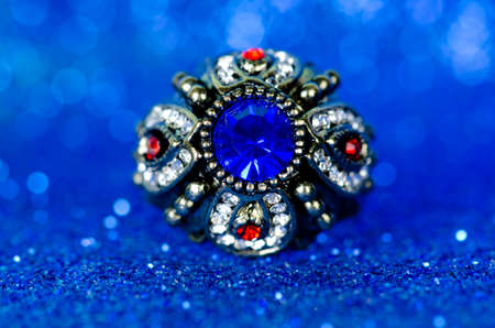 Jewellery ring against blue backgroundの写真素材