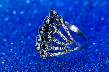 Jewellery ring against blue backgroundの写真素材