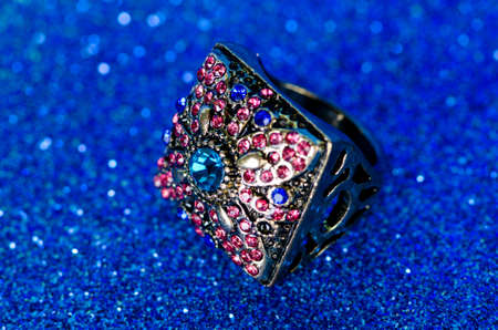 Jewellery ring against blue backgroundの写真素材