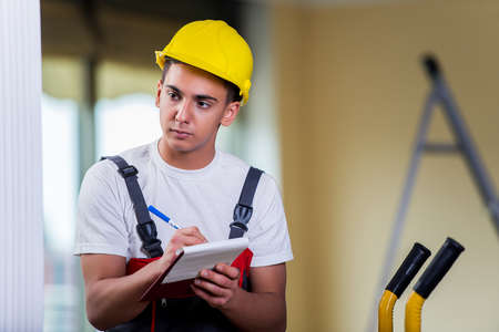 Man taking notes for delivery of boxes