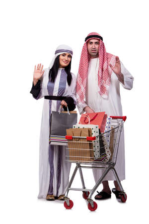 Happy arabic family after shopping isolated on whiteの写真素材