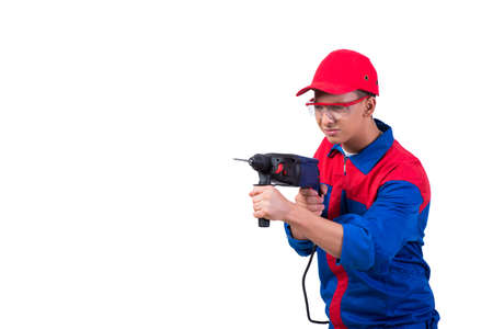 Young repairman with drill perforator isolated on white
