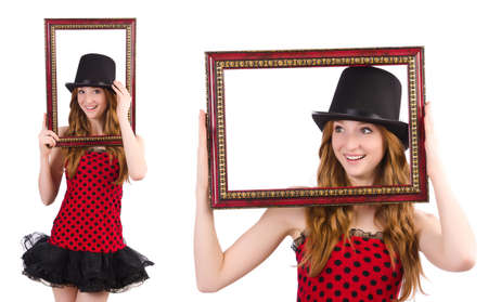 Pretty girl in red polka dot   dress with picture frame  isolated on white