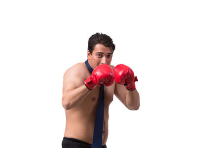 Ripped businessman with boxing gloves isolated on whiteの写真素材