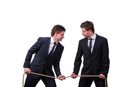Twin brothers in tug of war concept isolated on whiteの写真素材