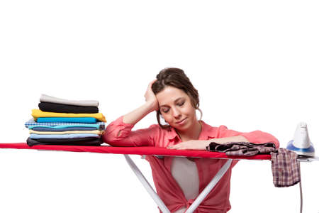 Young woman doing ironing isolated on whiteの写真素材