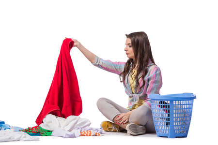 Woman tired after doing laundry isolated on white