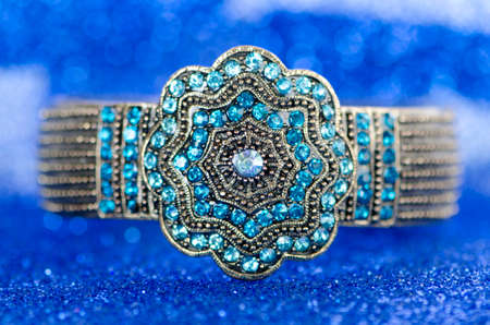 Jewellery ring against blue backgroundの写真素材