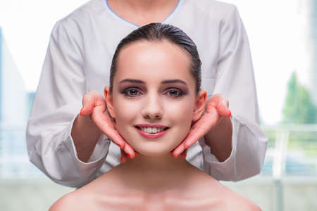 Young woman during face and skin massage sessionの写真素材